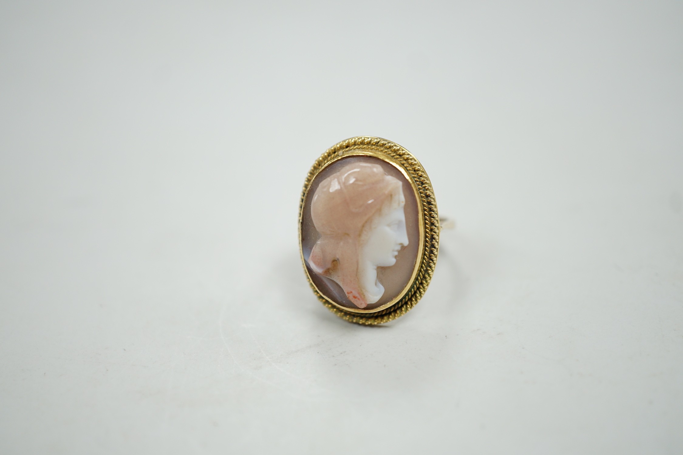 A modern 9ct gold and hardstone cameo ring, carved with the bust of a lady to sinister, size L, gross weight 4.9 grams.